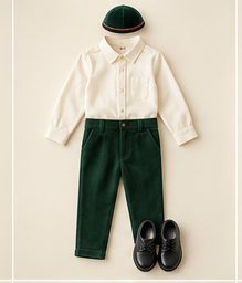 Boy: Ivory shirt, emerald corduroy pants, flat cap